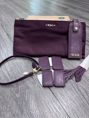 Tumi Plum Nylon Wristlet with Leather Tags and Strap